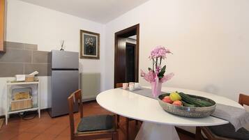 Apartment, Patio, Garden View | Private kitchen | Fridge, espresso maker, high chair, cookware/dishes/utensils