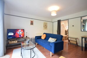 TV - Stylish 1-Bed Retreat with Garden & Rustic Kitchen (Greater Manchester)