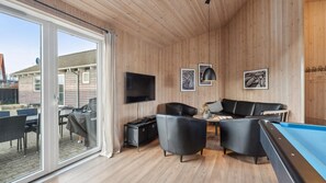 TV, fireplace, video game console, table football