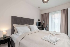 1 bedroom, desk, iron/ironing board, travel crib