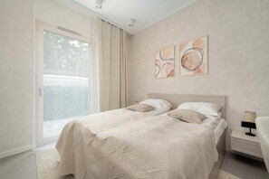 1 bedroom, desk, iron/ironing board, travel crib