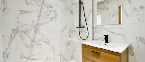 Shower, hair dryer, towels, soap