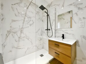 Shower, hair dryer, towels, soap