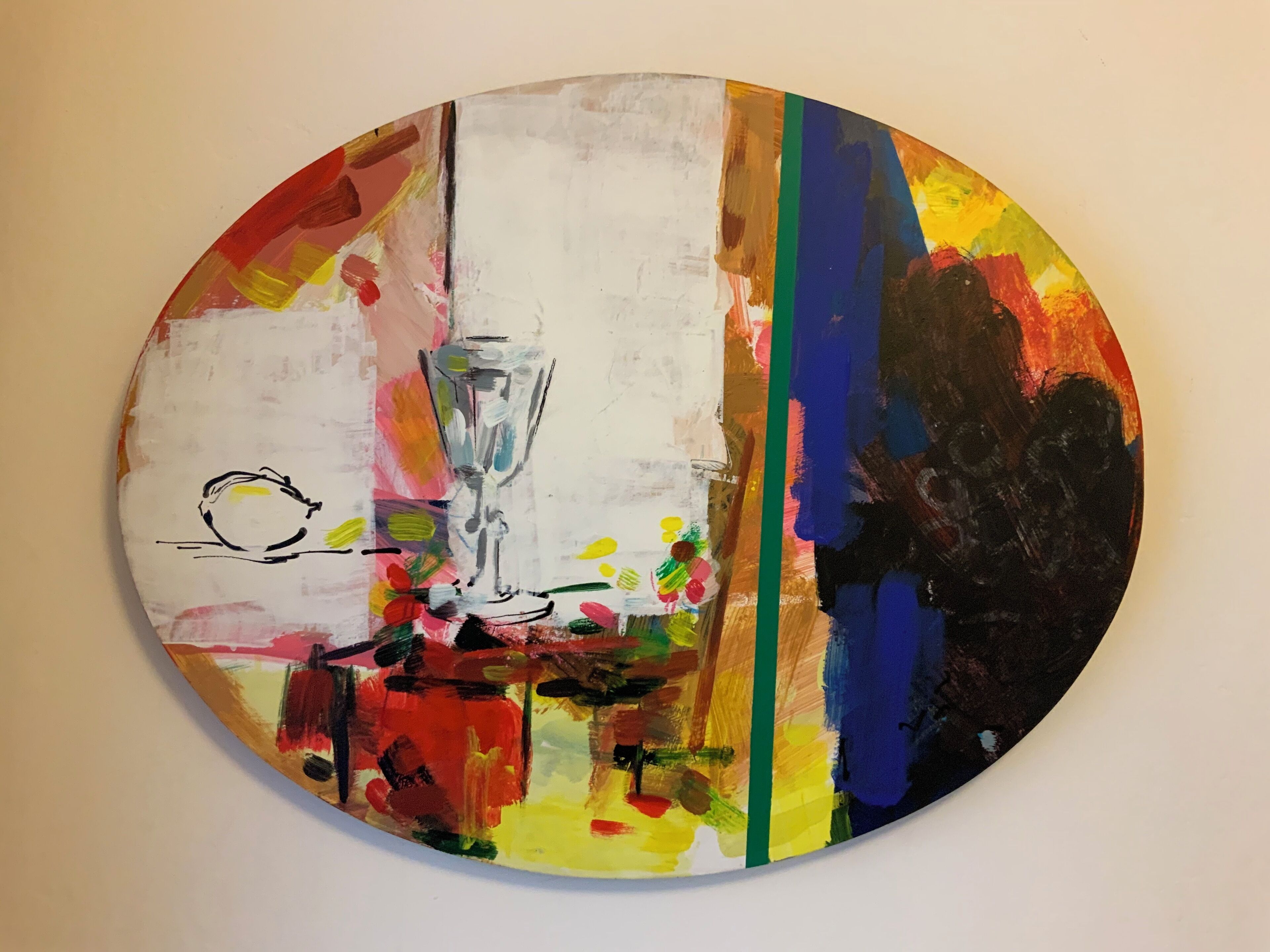 A circular artwork with abstract and colorful elements, including a vase and flowers.