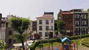 A multi-story building with a sign reading "Pastel" indicating a hotel or similar establishment.