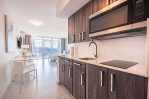 Fridge, microwave, stovetop, coffee/tea maker