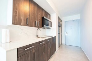 Fridge, microwave, stovetop, coffee/tea maker