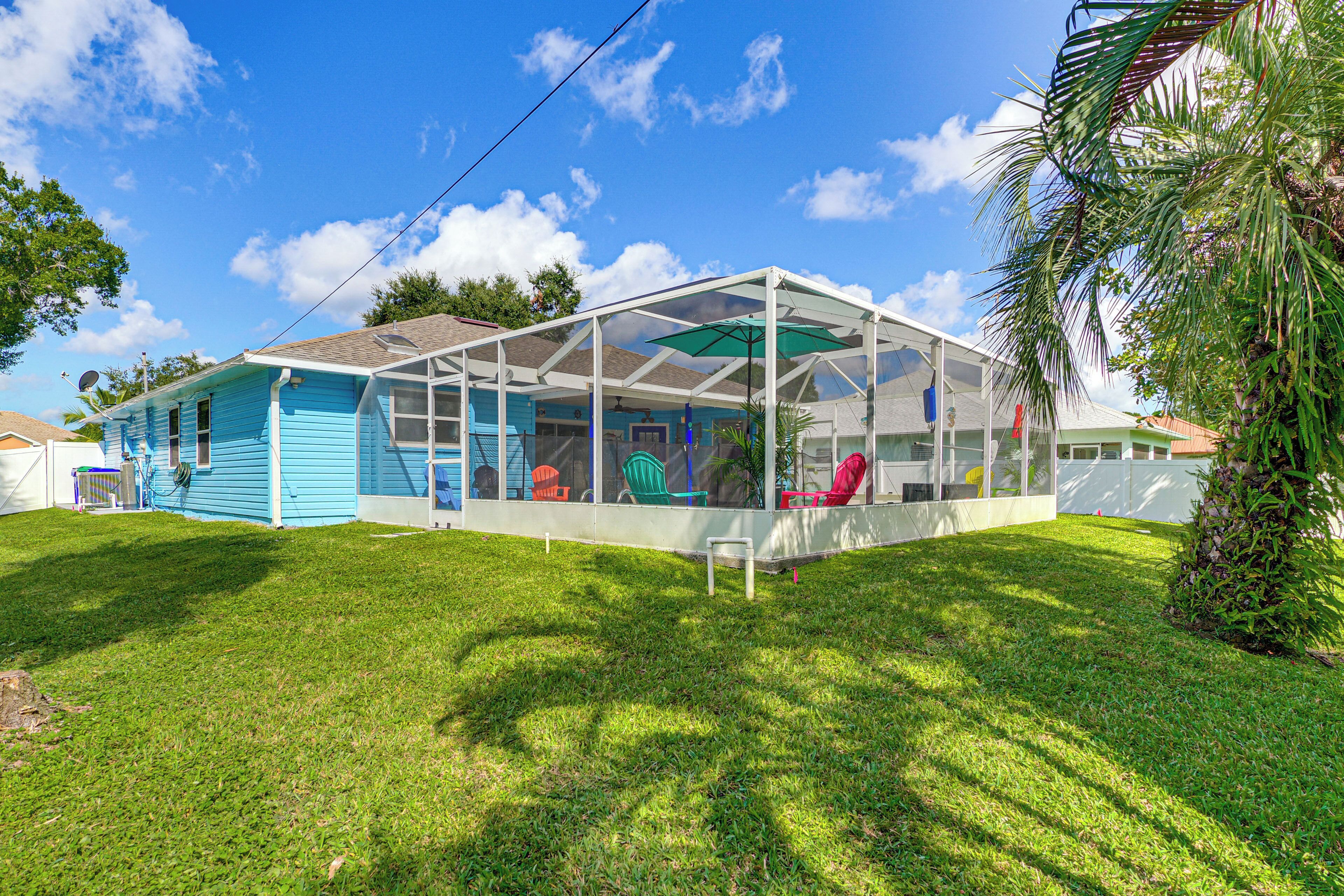 A house with a covered porch and a lawn.