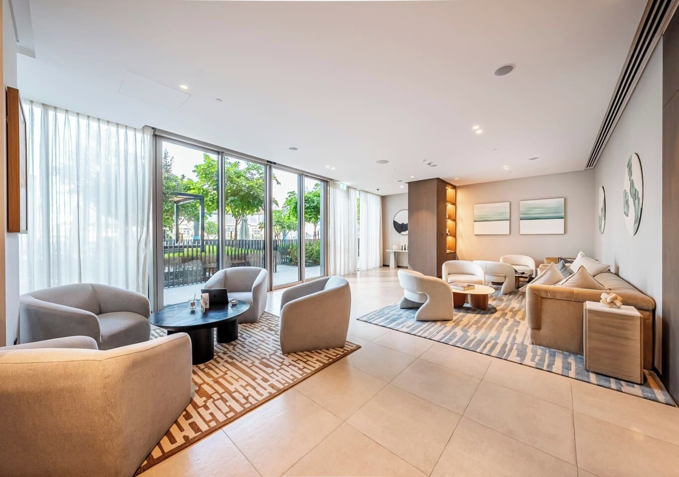 A modern living room with a sofa set, a coffee table, and a dining area.