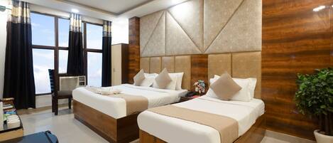 Premium bedding, pillowtop beds, desk, laptop workspace