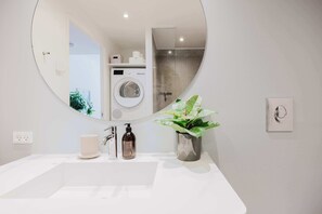 Shower, hair dryer, towels, shampoo