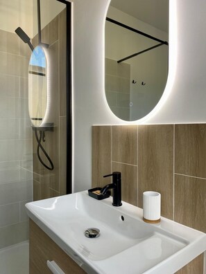 Shower, hair dryer, towels, soap