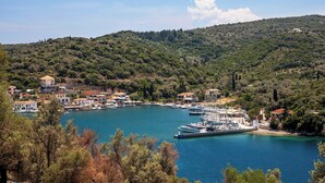 A coastal town with a marina, surrounded by hills and dense greenery. - Eolia - Three Bedroom Villa, Sleeps 6 (Nikiana)