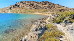 A coastal landscape with clear waters, rocky terrain, and a path leading to a beach. - Villa Espera - Five Bedroom Villa, Sleeps 10 (Santa Maria)