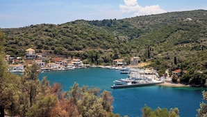 A coastal town with a marina, surrounded by hills and dense greenery. - Oikos Nostos - Three Bedroom Villa, Sleeps 6 (Lefkada City)