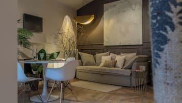 Basic Apartment, Balcony | Living area | 30-inch TV with satellite channels