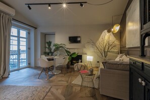 Basic Apartment, Balcony | Living area | 30-inch TV with satellite channels