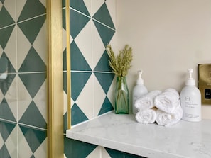 Shower, hair dryer, towels, soap