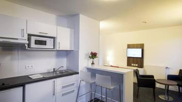 Microwave, cookware/dishes/utensils, dining tables