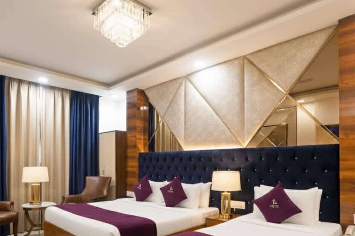 Premium bedding, memory-foam beds, desk, laptop workspace