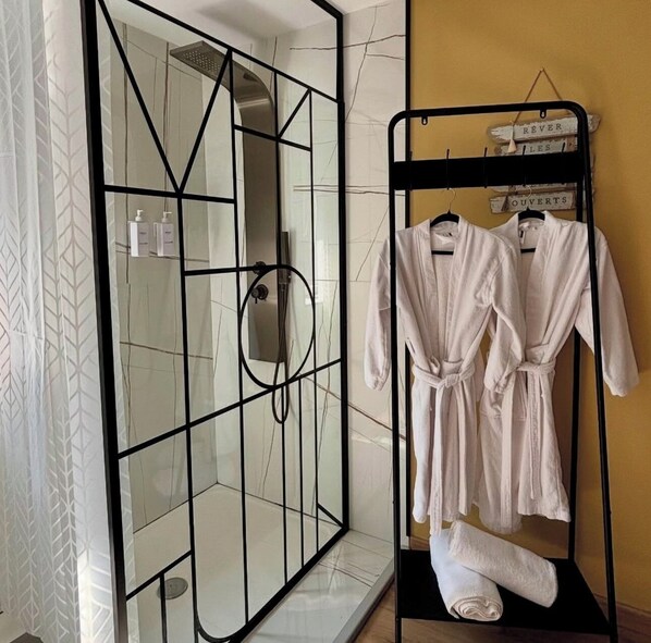 Shower, hair dryer, towels, soap