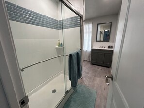 Shower, hair dryer, towels, toilet paper