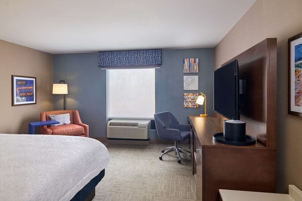 Settle into a spacious room with seating and daylight.