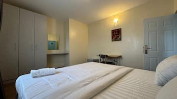Family Apartment, Balcony, City View | Desk, laptop workspace, blackout curtains, soundproofing