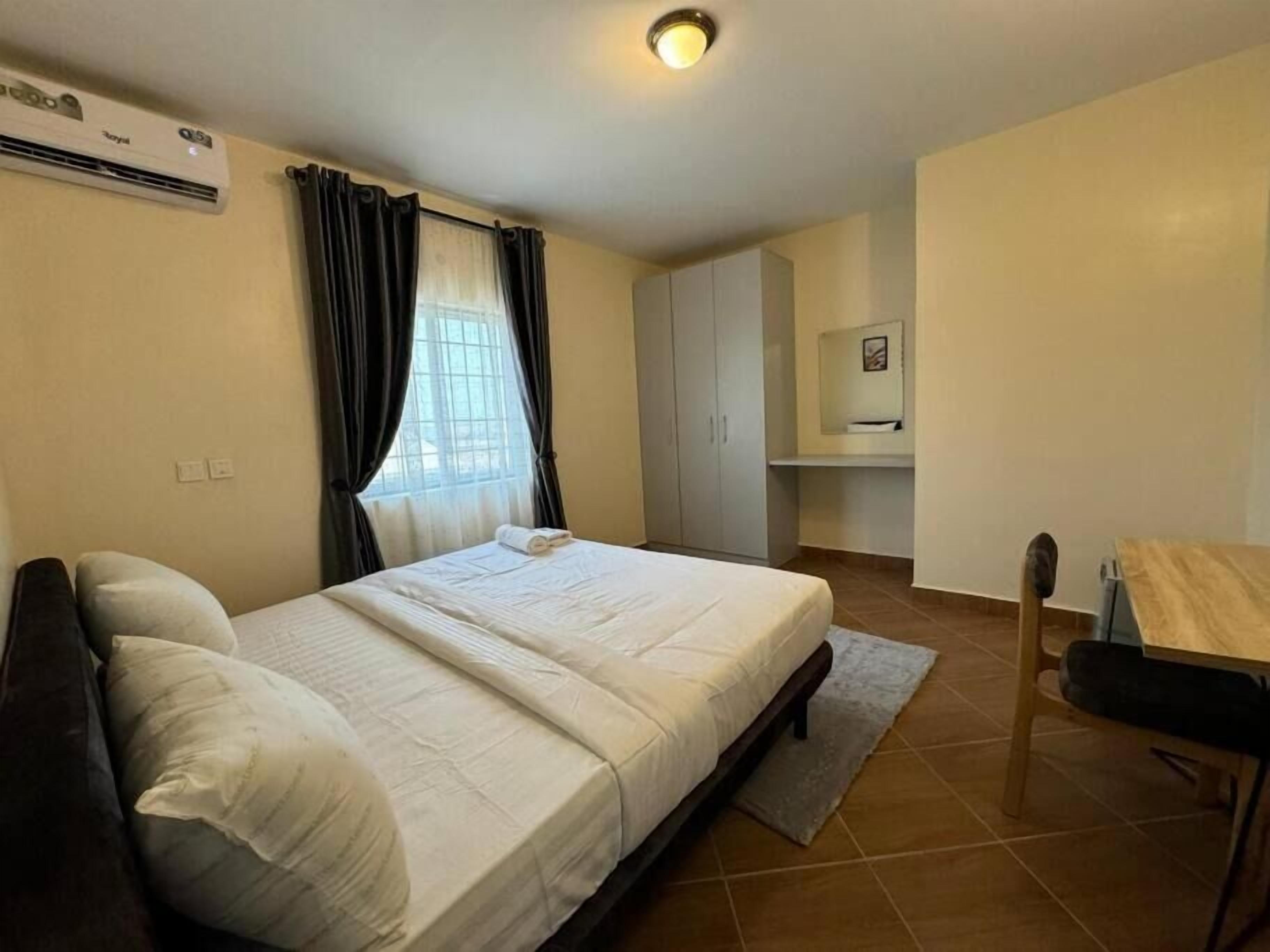 Family Apartment, Balcony, City View | Desk, laptop workspace, blackout drapes, soundproofing