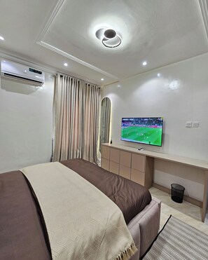 Deluxe Apartment, Balcony, City View | Desk, laptop workspace, blackout drapes, soundproofing