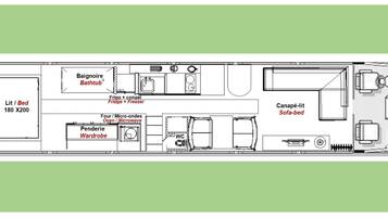 A detailed floor plan of a train carriage with a Lit/Bed area, Baigneoire Bathtub, Frigo + freezer, four micro-ondes, oven/microwave, wardrobe, WC, and a sofa-bed.