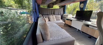 Unique and unusual: "Iliade" bus in a green and relaxing environment