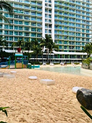 Private beach, white sand, sun loungers, beach umbrellas