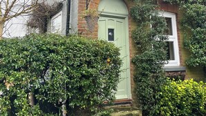 A brick house with a green door, a small window, and a chimney. - Charming countryside cottage near Canterbury, Kent (Bekesbourne)