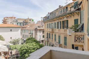 A row of buildings with balconies and shutters, typical of Mediterranean architecture.