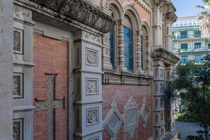 A building with intricate architectural details, including ornate carvings and a brick facade.