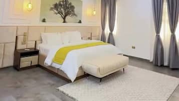 Deluxe Apartment, Balcony, City View | In-room safe, desk, laptop workspace, blackout drapes