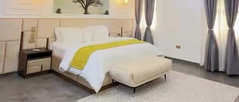 Deluxe Apartment, Balcony, City View | In-room safe, desk, laptop workspace, blackout curtains