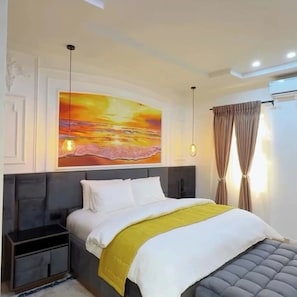 Deluxe Apartment, Balcony, City View | In-room safe, desk, laptop workspace, blackout curtains