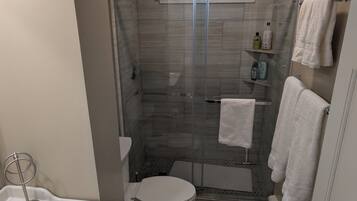 Shower, towels, soap, toilet paper