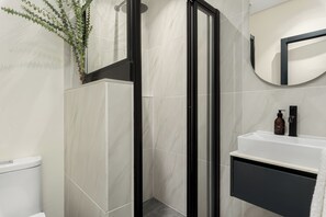 Shower, hair dryer, towels, soap