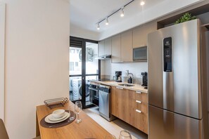 Fridge, microwave, cookware/dishes/utensils