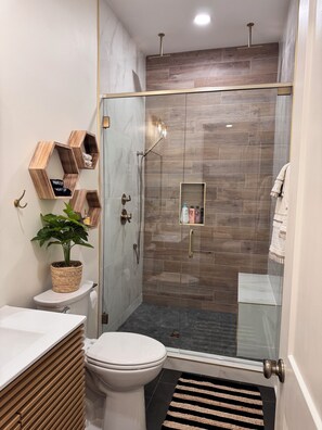 Shower, towels, soap, toilet paper