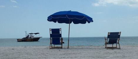 On the beach, sun loungers, beach towels