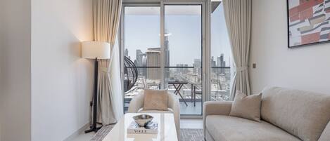 Luxury Apartment, Balcony, City View | Living area | 65-inch Smart TV with satellite channels