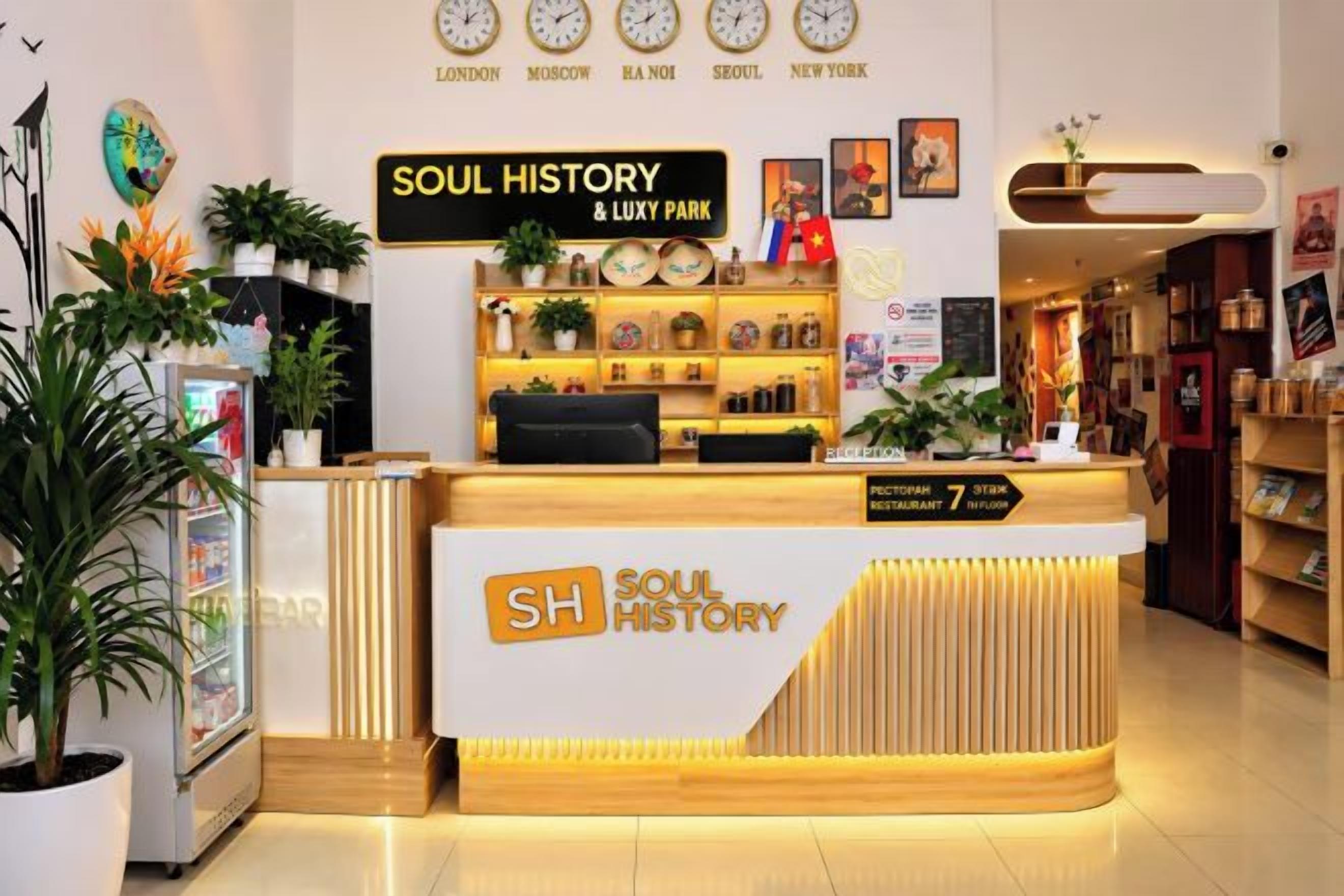 A reception desk with a sign reading 'SOUL HISTORY & LUXY PARK' and a list of cities including London, Moscow, and New York.