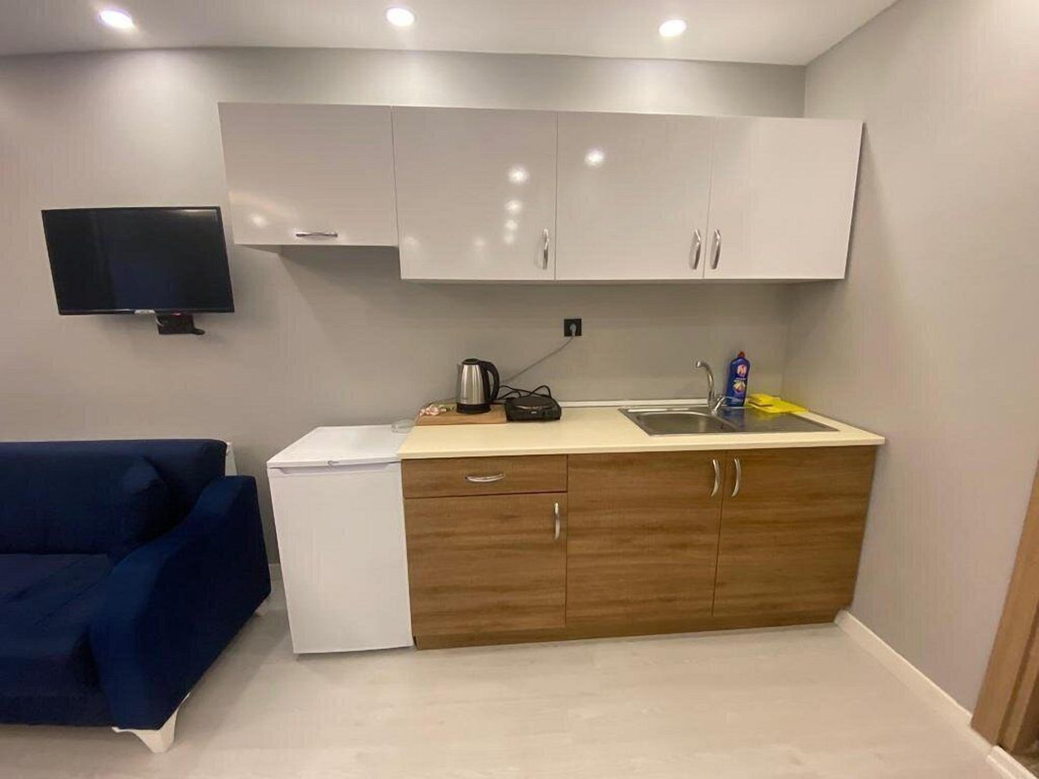 Suíte estúdio luxo, sacada, vista para a cidade | Cozinha privada | Frigobar, cooktop, talheres/pratos/utensílios de cozinha