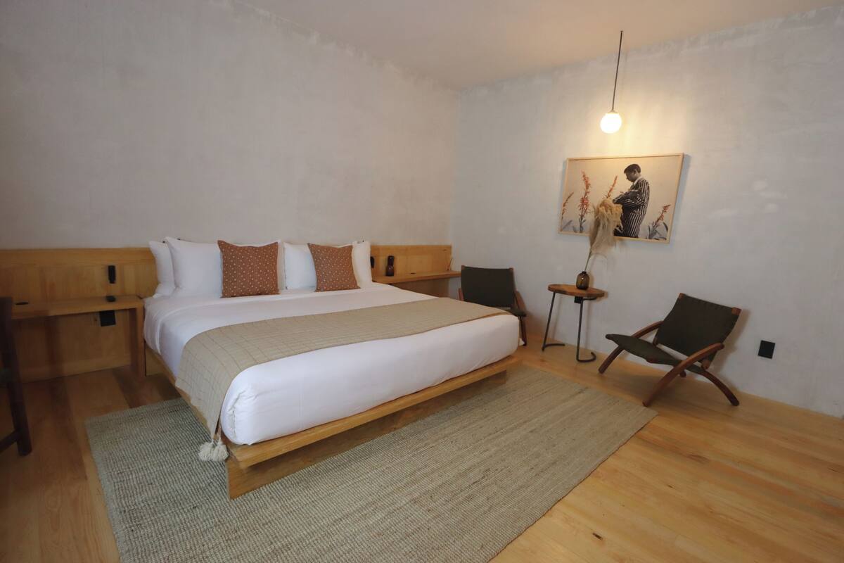 Junior Room, Courtyard View | In-room safe, desk, laptop workspace, iron/ironing board