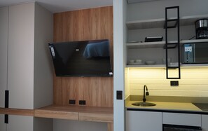 Mini-fridge, microwave, stovetop, cookware/dishes/utensils
