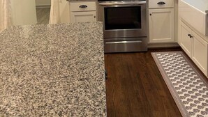 A kitchen with white cabinets, a stainless steel microwave, a double oven, granite countertops, and a patterned rug. - Modern Beauty in Crestline Park (Birmingham)